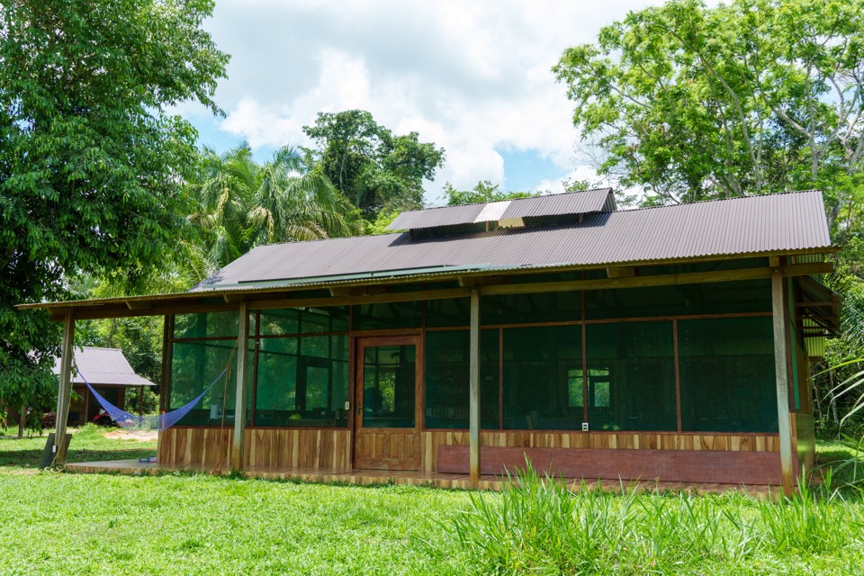 The station's central office, a long screened building with hammocks behind green mesh